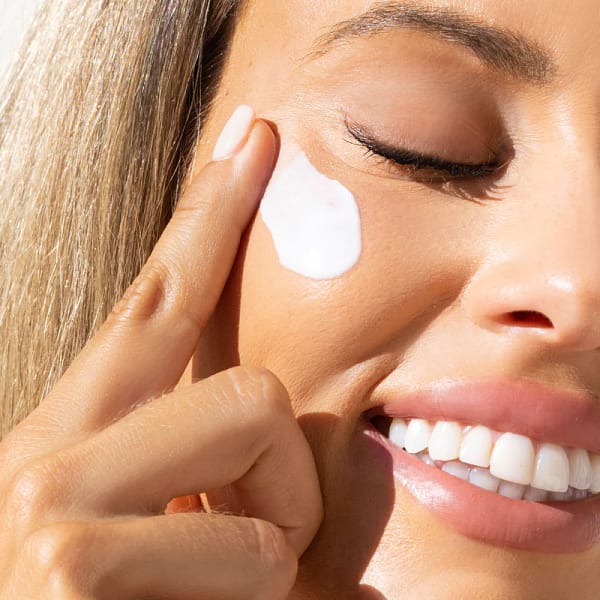 IMAGE PREVENTION+® daily matte moisturizer SPF 30 being applied to face by smiling woman